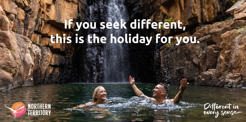 Image of a couple in Southern Rockhole waterfall, with text saying 'If you seek different, this is the holiday for you'